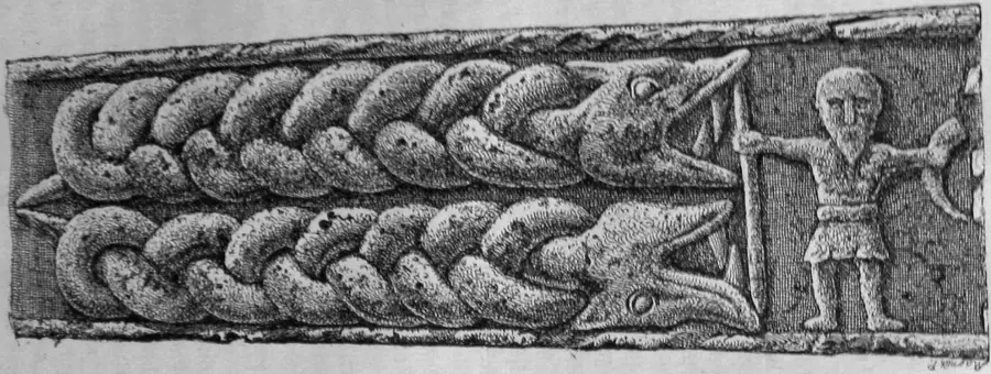 Carved stone panel showing bound and fighting beasts in interlaced Norse style.