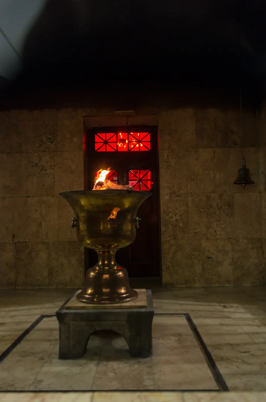 Modern Zoroastrian fire temple with a winged-figure relief above the entrance.